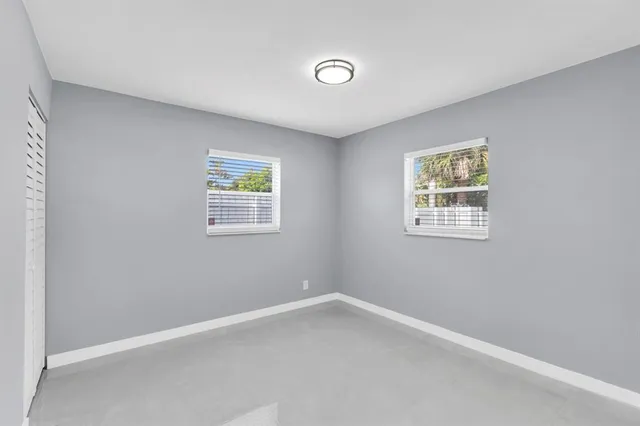 an empty room with windows