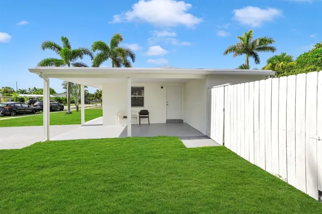 a view of a backyard with a garden and plants