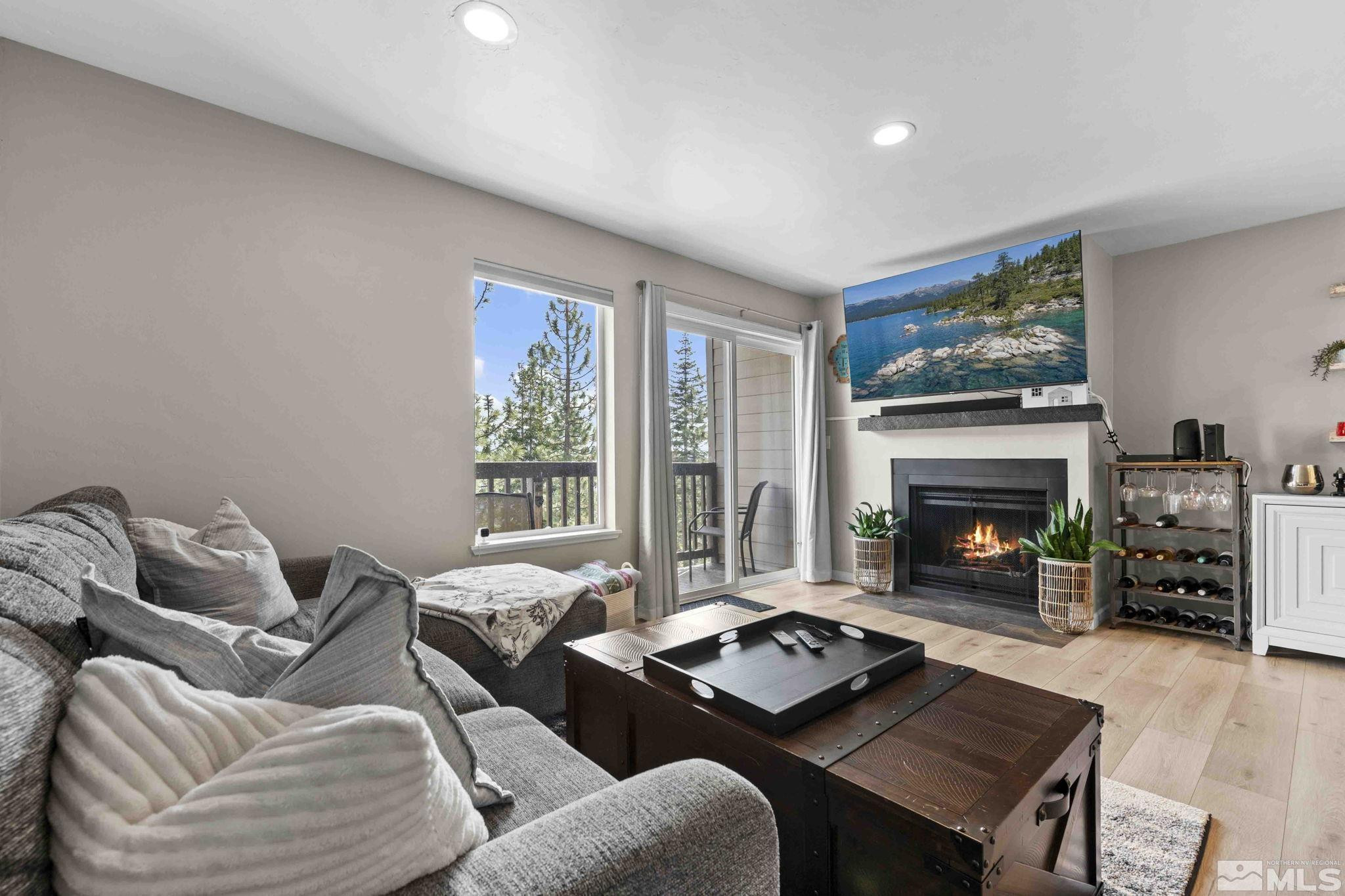 115 Tramway Drive, Unit 2 Stateline, NV 89449 - Photo 6 of 22 a living room with furniture and a fireplace