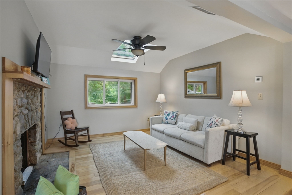 15 Log Cabin Road Ashburnham, MA 01430 - Photo 8 of 24 a living room with furniture a fireplace and a flat screen tv