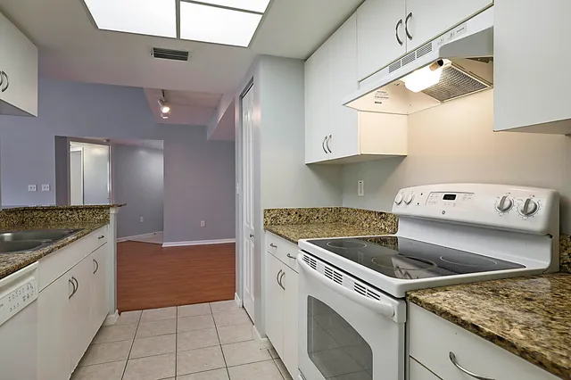 a kitchen with a stove and a sink