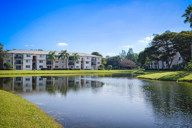 a view of swimming pool with outdoor seating and yard