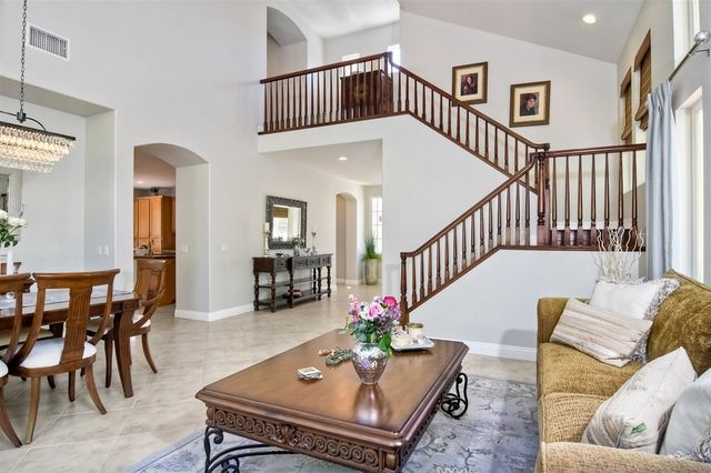 a living room with furniture and a table