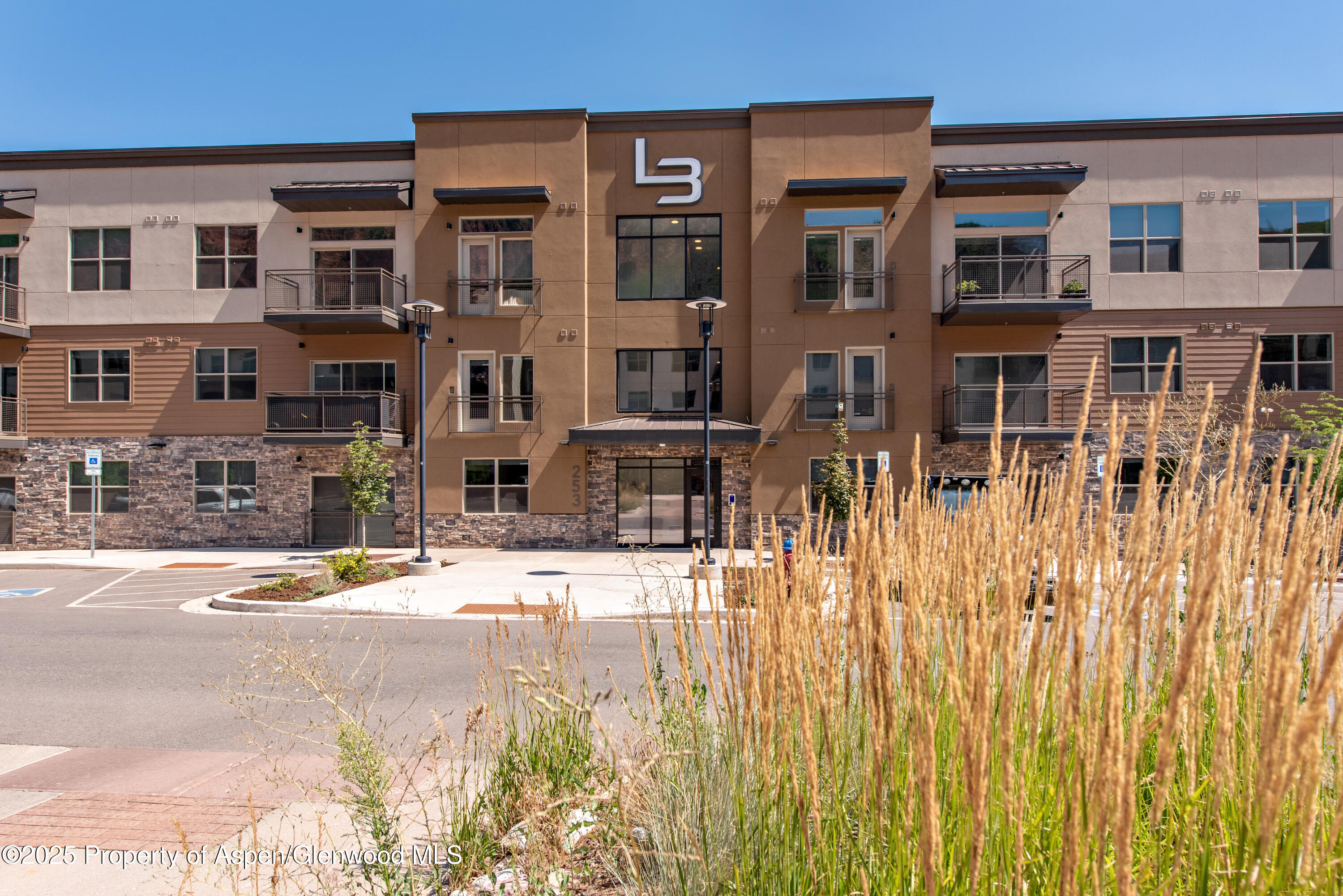 253 Wulfsohn Road, Unit 124 Glenwood Springs, CO 81601 - Photo 1 of 4 a view of a building with a street