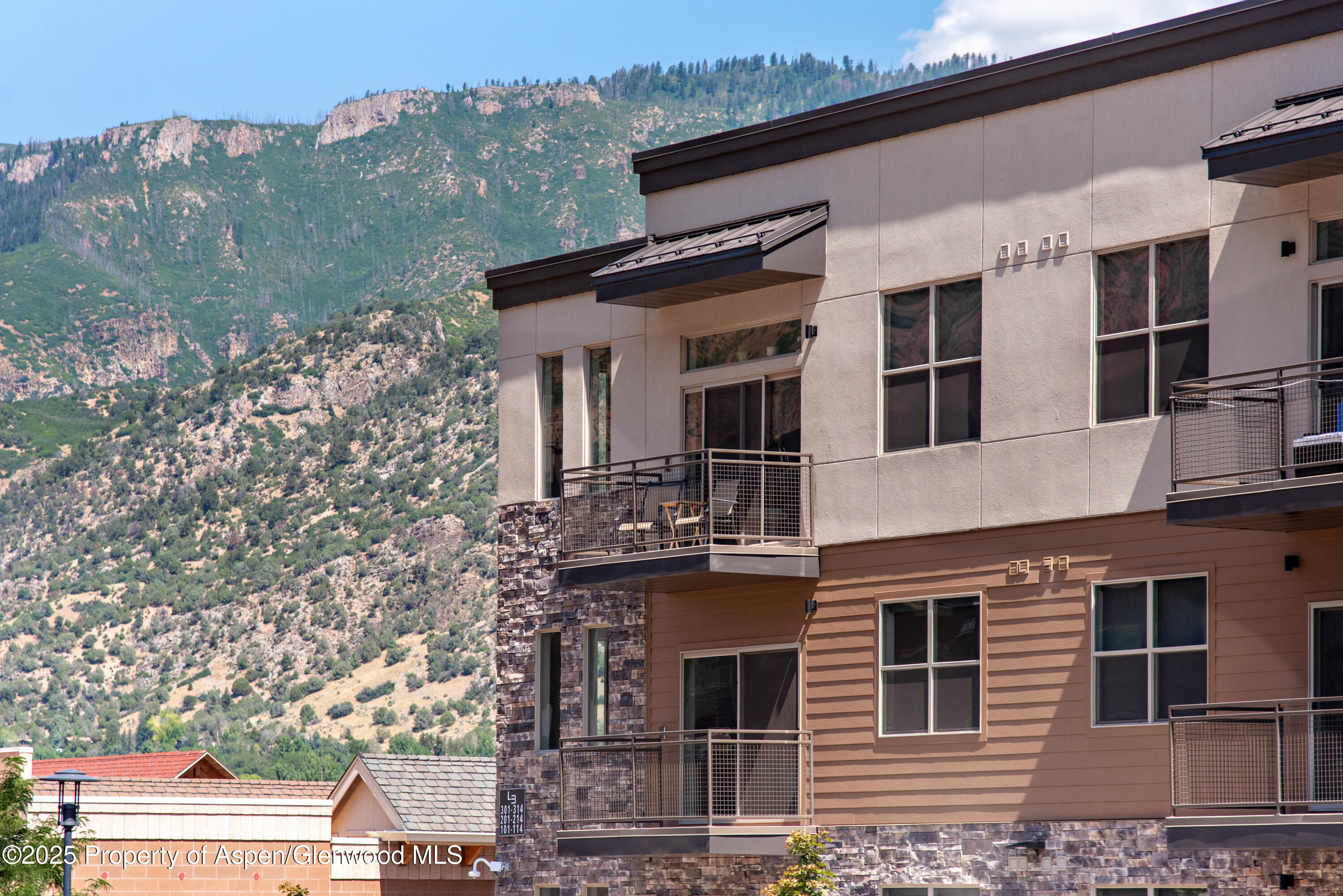 253 Wulfsohn Road, Unit 124 Glenwood Springs, CO 81601 - Photo 4 of 4 a view of a building with a large windows