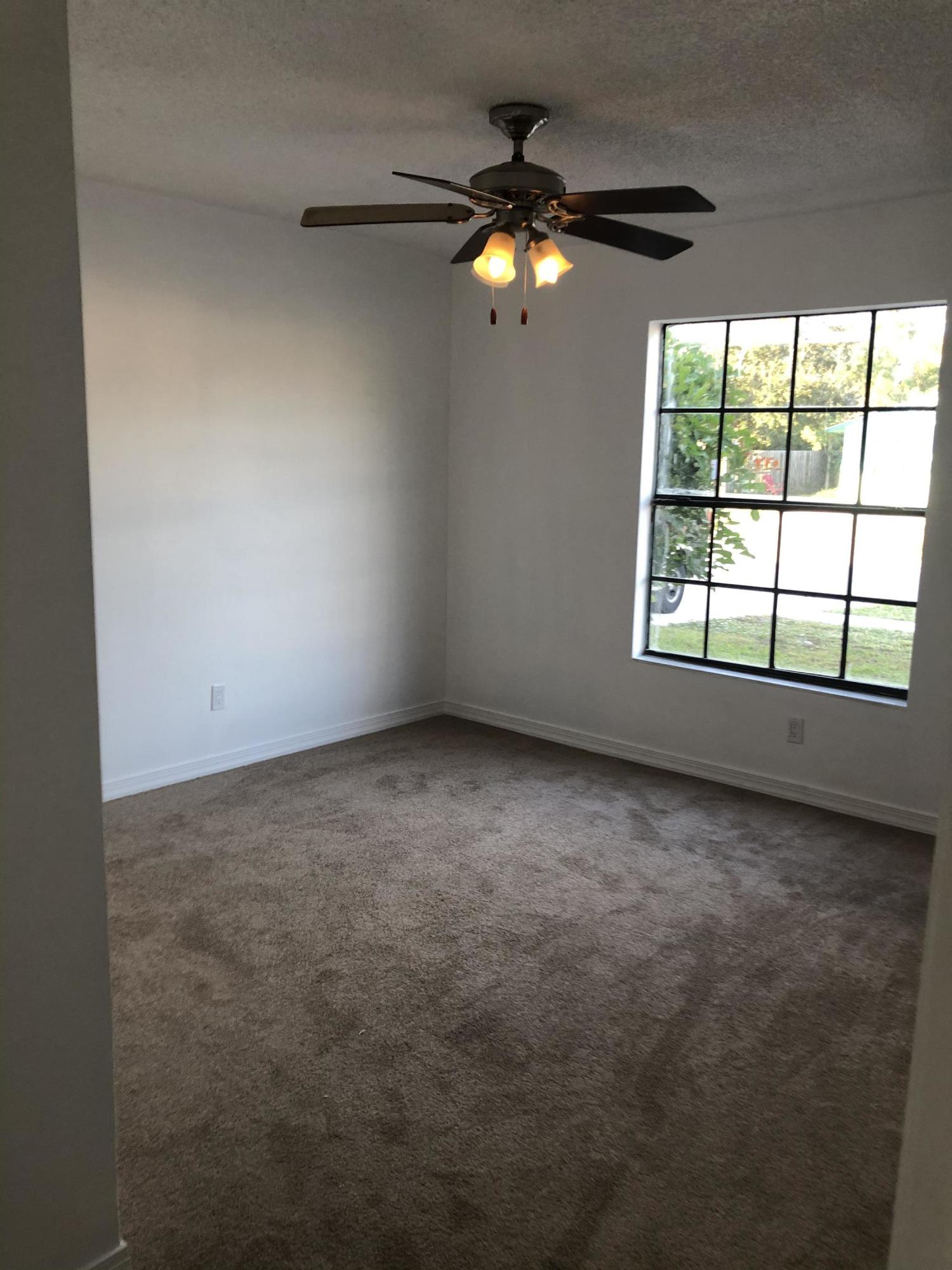 5128 Southeast Primrose Way Stuart, FL 34997 - Photo 9 of 19 AA3B6239-3B05-4725-AB71-695DD47B57FE
