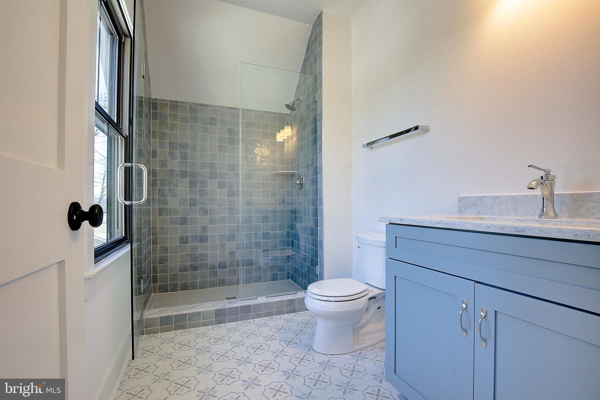 13 Elliott Road Annapolis, MD 21403 - Photo 13 of 14 a bathroom with a sink a toilet and shower