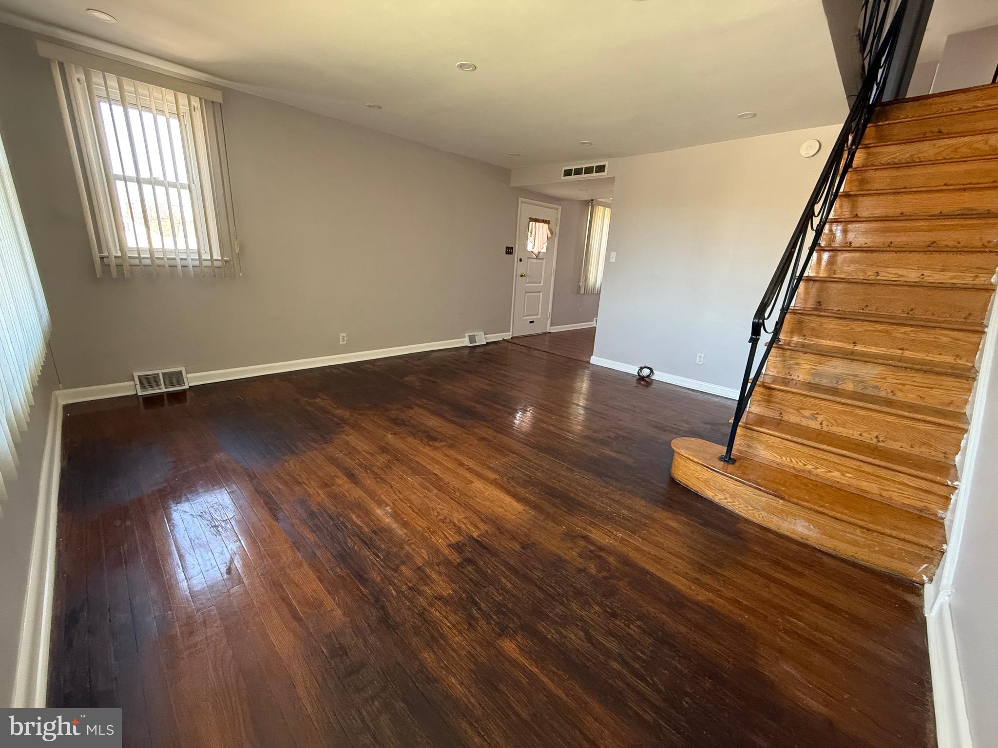 9083 Convent Avenue Philadelphia, PA 19136 - Photo 11 of 22 wooden floor in an empty room with a window