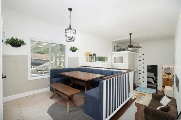 a dining room with furniture and windows
