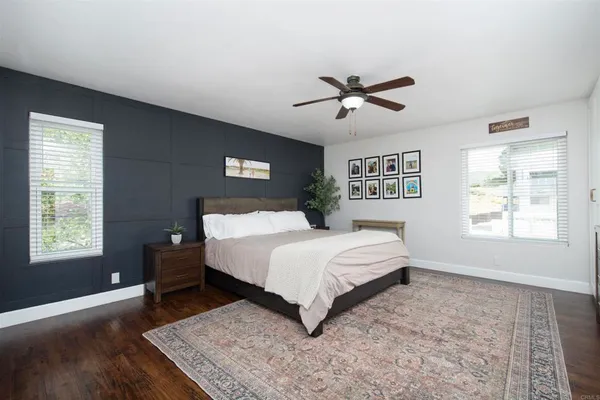 a bedroom with a large bed and a window