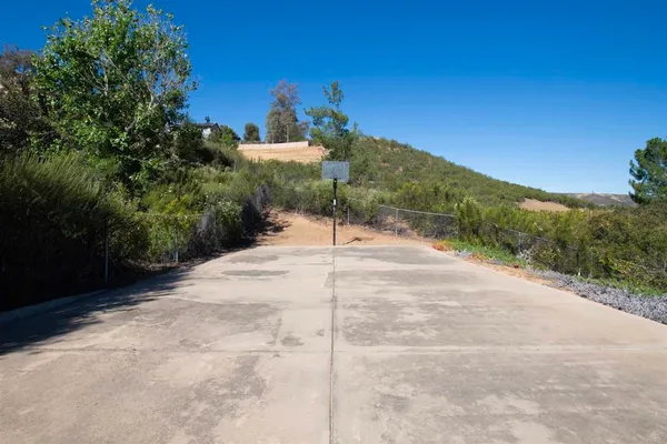 a view of a road with a yard