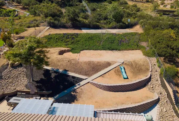 a view of a swimming pool with a yard