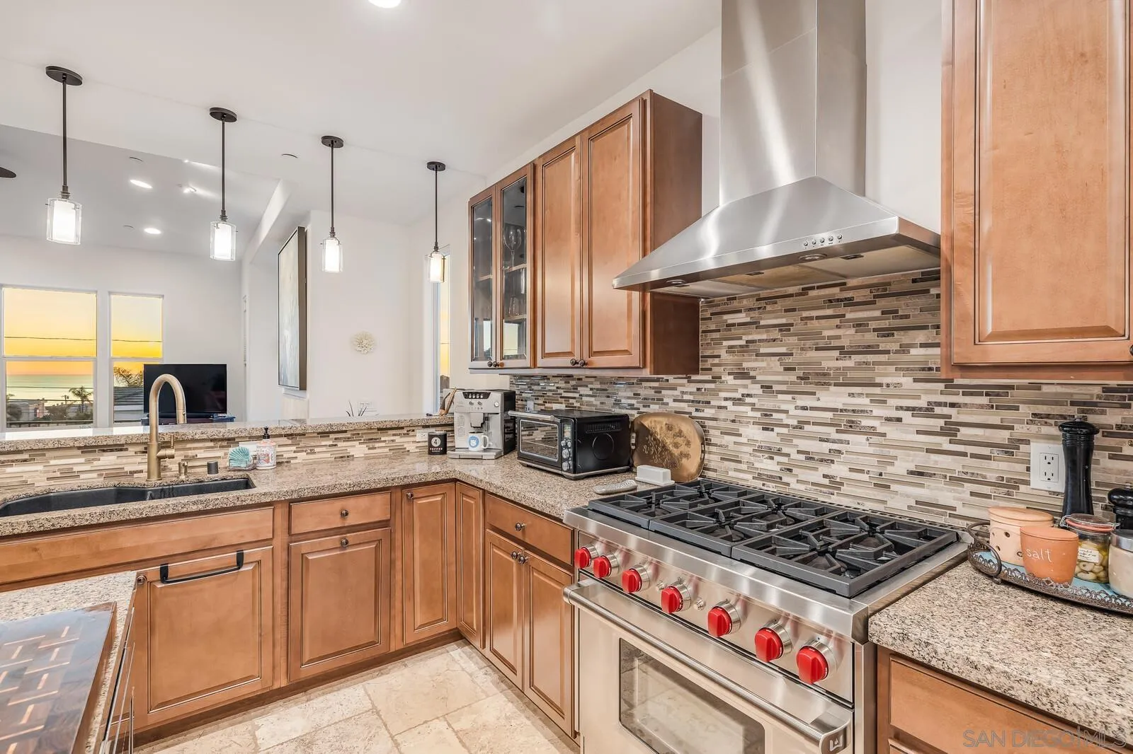 2009 MacKinnon Avenue Cardiff, CA 92007 - Photo 11 of 54 a kitchen with a stove a sink a refrigerator and cabinets