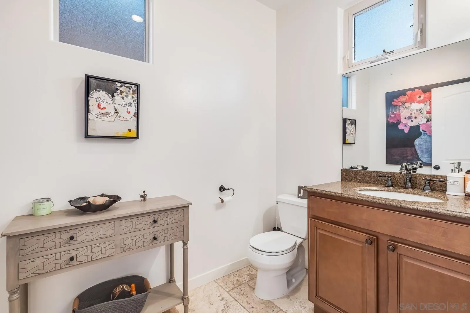 2009 MacKinnon Avenue Cardiff, CA 92007 - Photo 12 of 54 a bathroom with a granite countertop toilet sink and mirror
