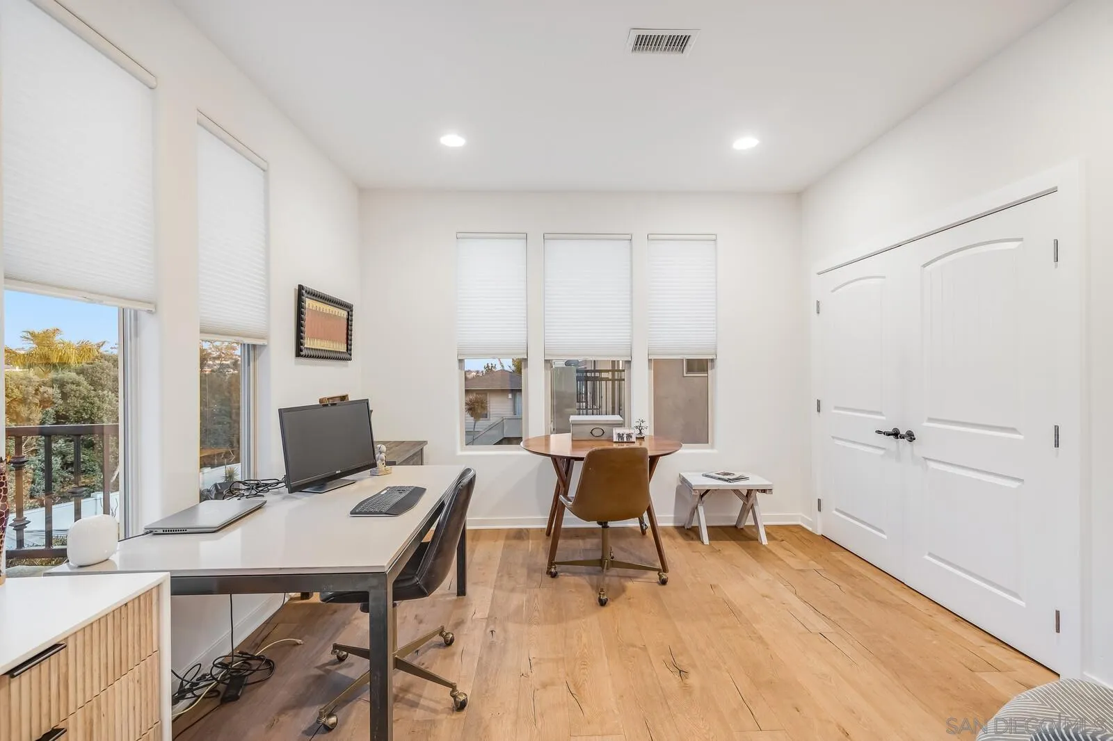 2009 MacKinnon Avenue Cardiff, CA 92007 - Photo 17 of 54 a view of a workspace with furniture and a window