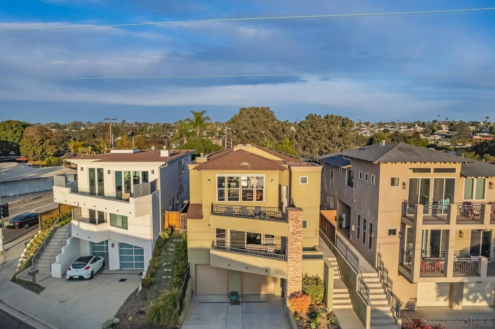 2009 MacKinnon Avenue Cardiff, CA 92007 - Photo 41 of 54 a view of a large building with a view of a city from a terrace
