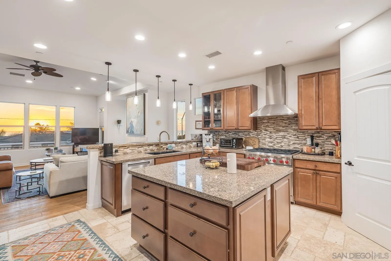 2009 MacKinnon Avenue Cardiff, CA 92007 - Photo 10 of 54 a kitchen with stainless steel appliances granite countertop a lot of counter space sink and stove