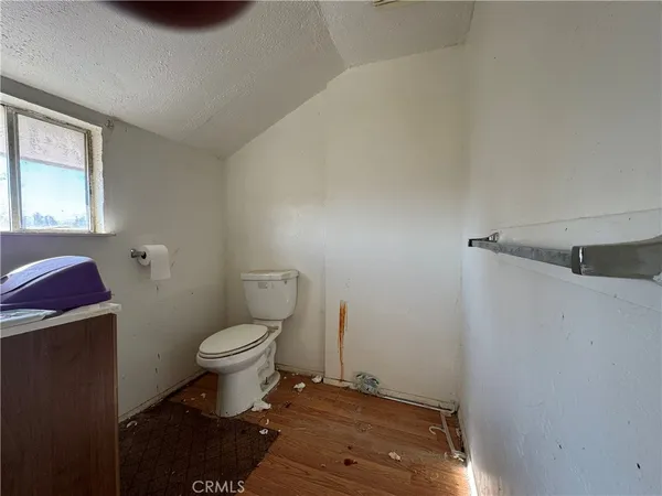 a bathroom with a toilet and a vanity