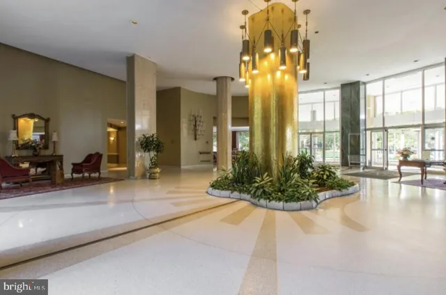 a lobby with a chandelier and living room