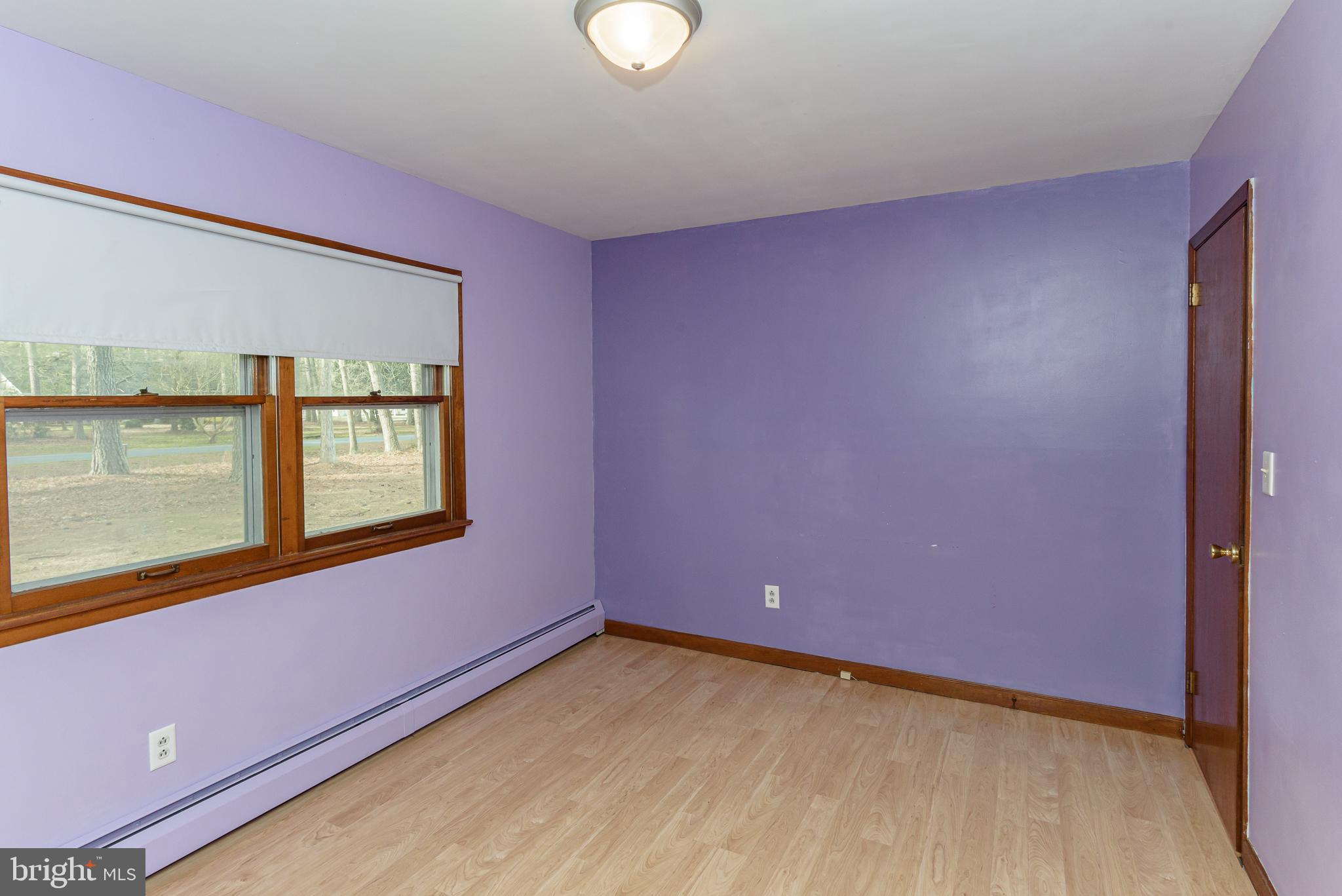 1745 Buck Harbor Road Pocomoke City, MD 21851 - Photo 16 of 29 a view of an empty room with a window