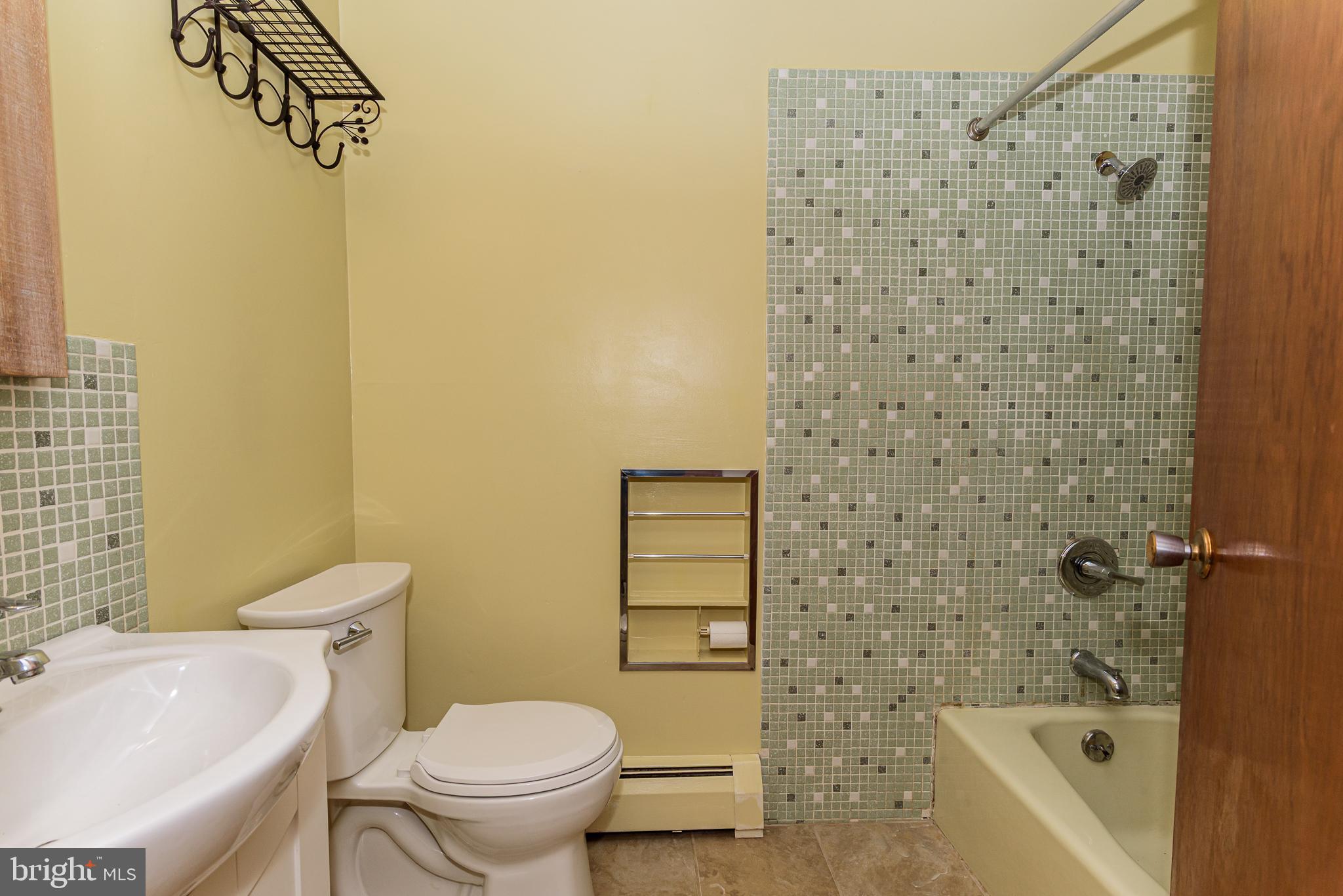 1745 Buck Harbor Road Pocomoke City, MD 21851 - Photo 18 of 29 a bathroom with a toilet and a sink