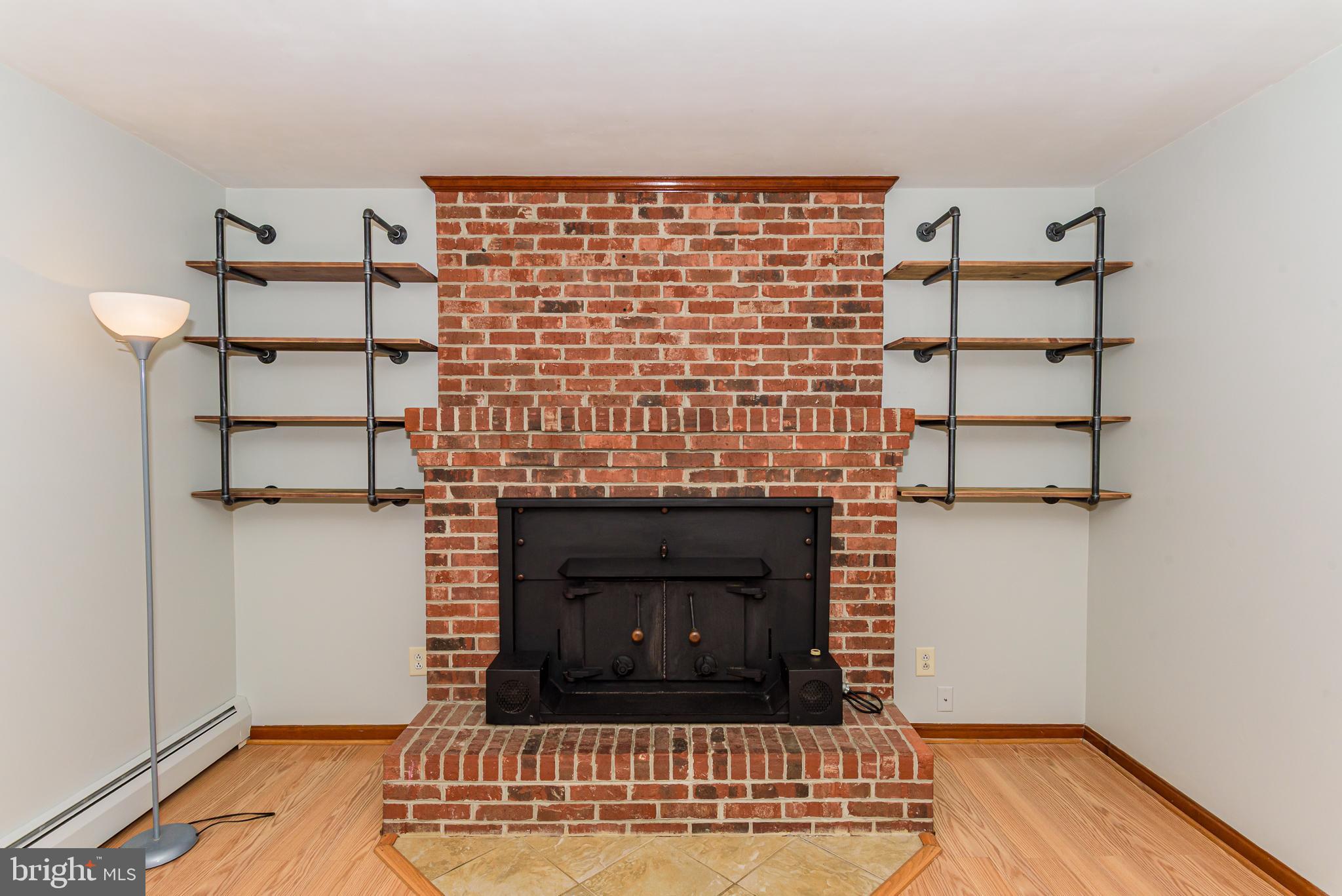 1745 Buck Harbor Road Pocomoke City, MD 21851 - Photo 8 of 29 a living room with a fireplace