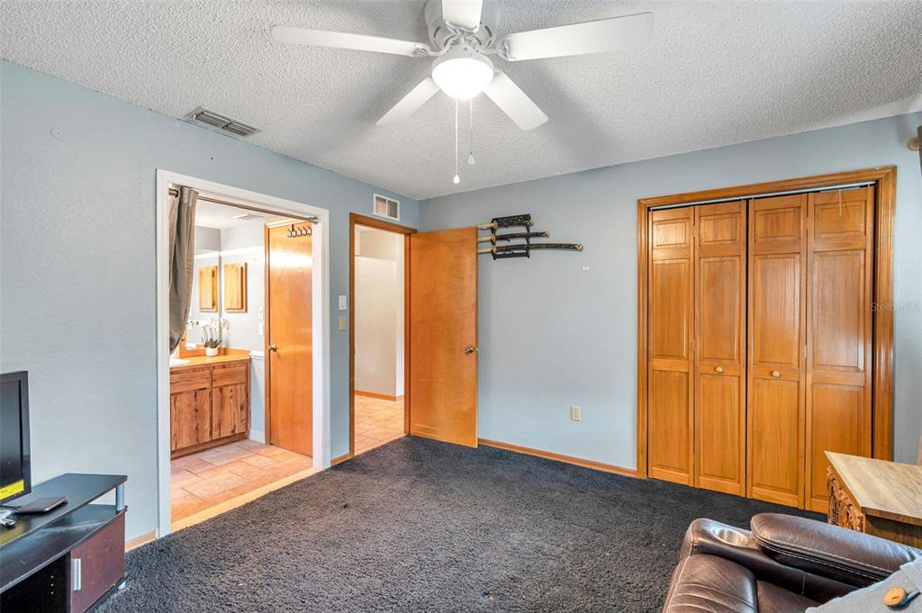 11334 Redgate Street Spring Hill, FL 34609 - Photo 16 of 67 a view of livingroom with workspace