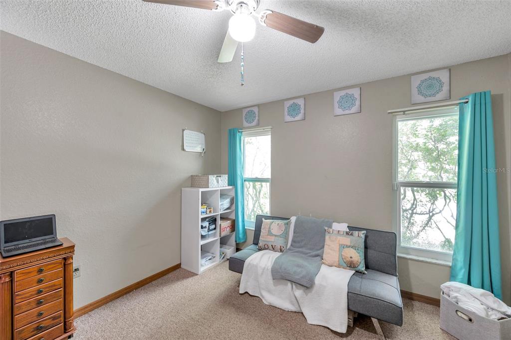11334 Redgate Street Spring Hill, FL 34609 - Photo 36 of 67 a living room with furniture and a window