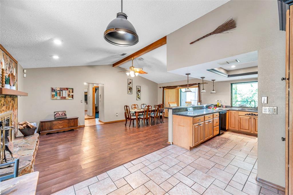 11334 Redgate Street Spring Hill, FL 34609 - Photo 39 of 67 a kitchen with lots of counter top and dining table