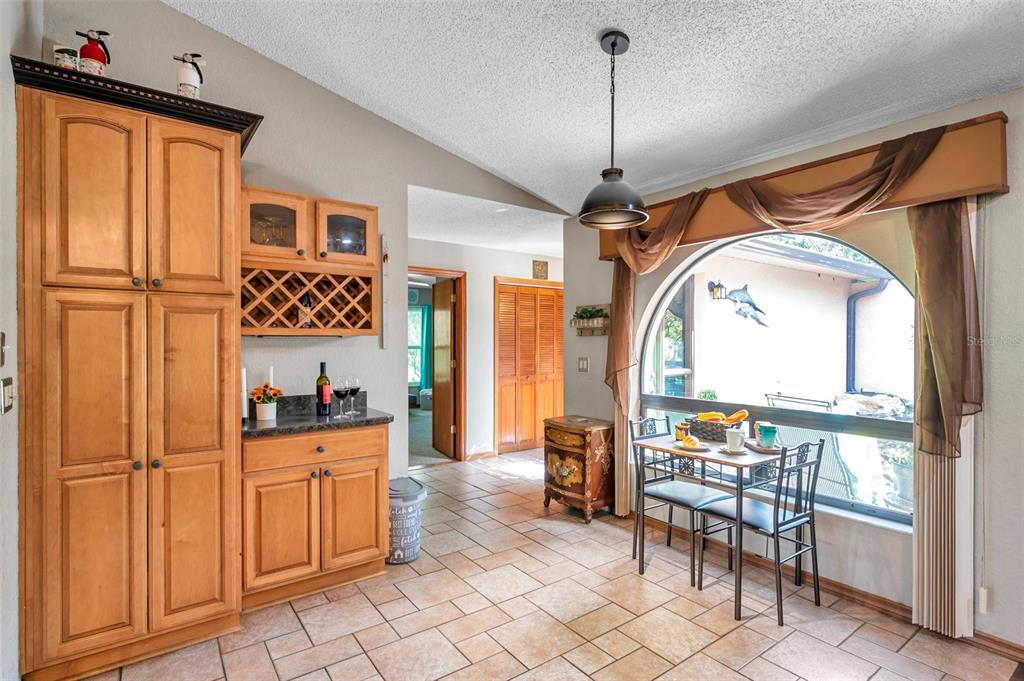 11334 Redgate Street Spring Hill, FL 34609 - Photo 40 of 67 a living room with furniture a flat screen tv and a window