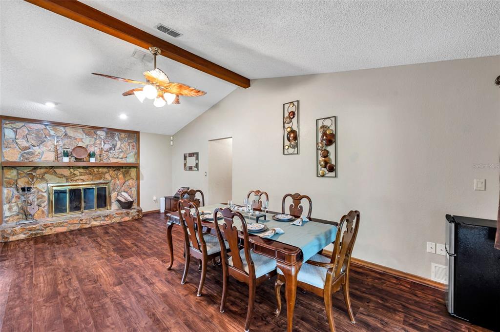 11334 Redgate Street Spring Hill, FL 34609 - Photo 45 of 67 a view of a dining room with furniture and wooden floor