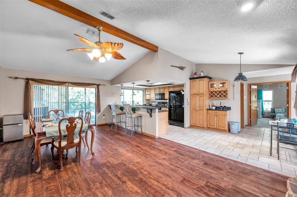 11334 Redgate Street Spring Hill, FL 34609 - Photo 47 of 67 a view of a dining room with furniture window and wooden floor