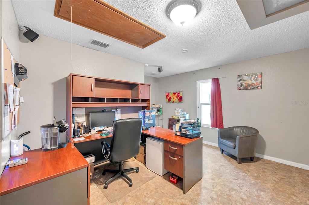 11334 Redgate Street Spring Hill, FL 34609 - Photo 53 of 67 a view of a workspace with furniture and a workspace