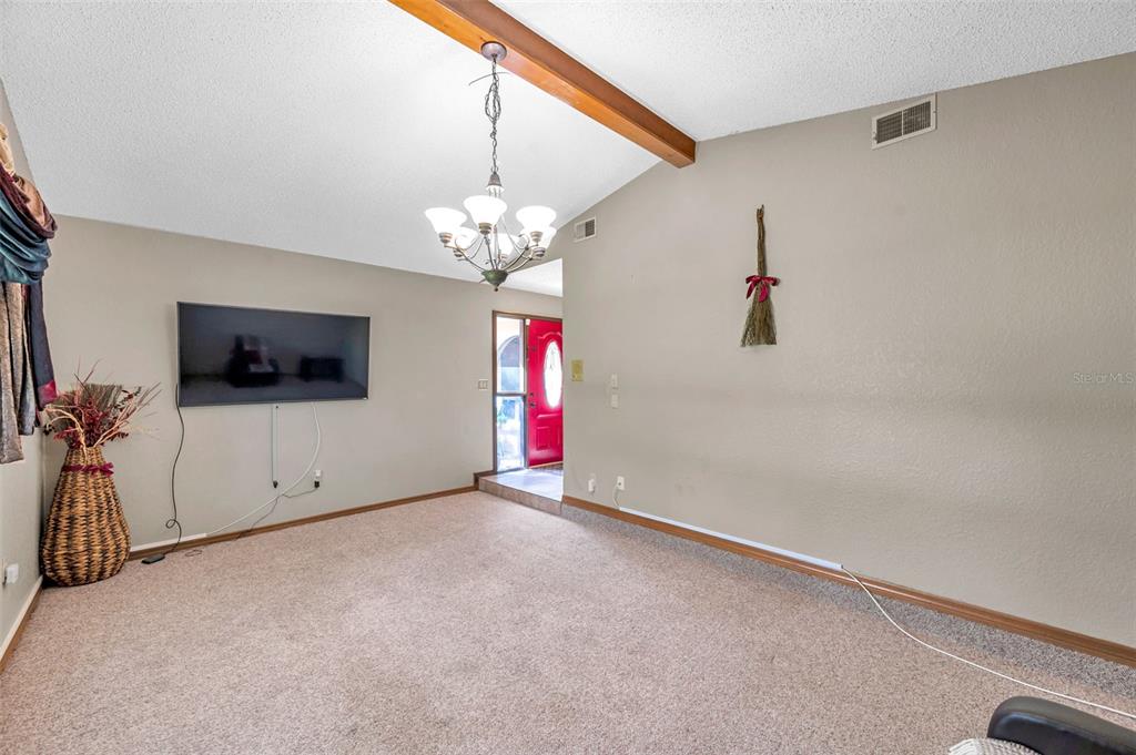11334 Redgate Street Spring Hill, FL 34609 - Photo 56 of 67 a view of empty room with a flat screen tv