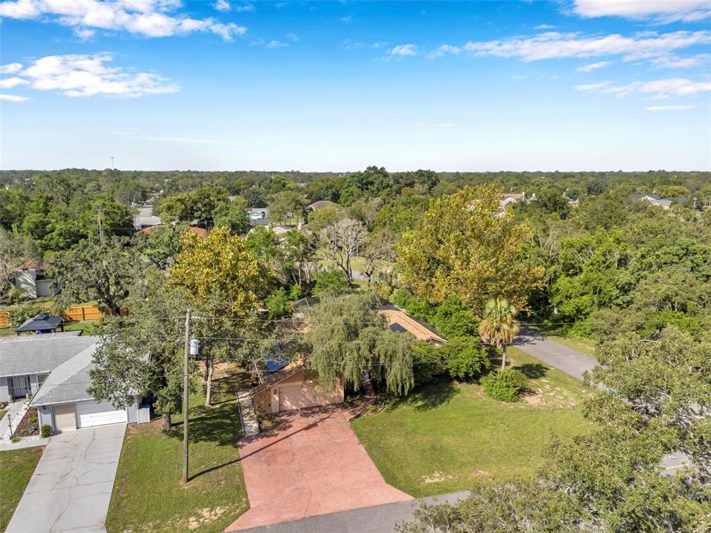 11334 Redgate Street Spring Hill, FL 34609 - Photo 61 of 67 an aerial view of residential houses with outdoor space