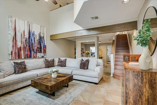a living room with furniture and a large window