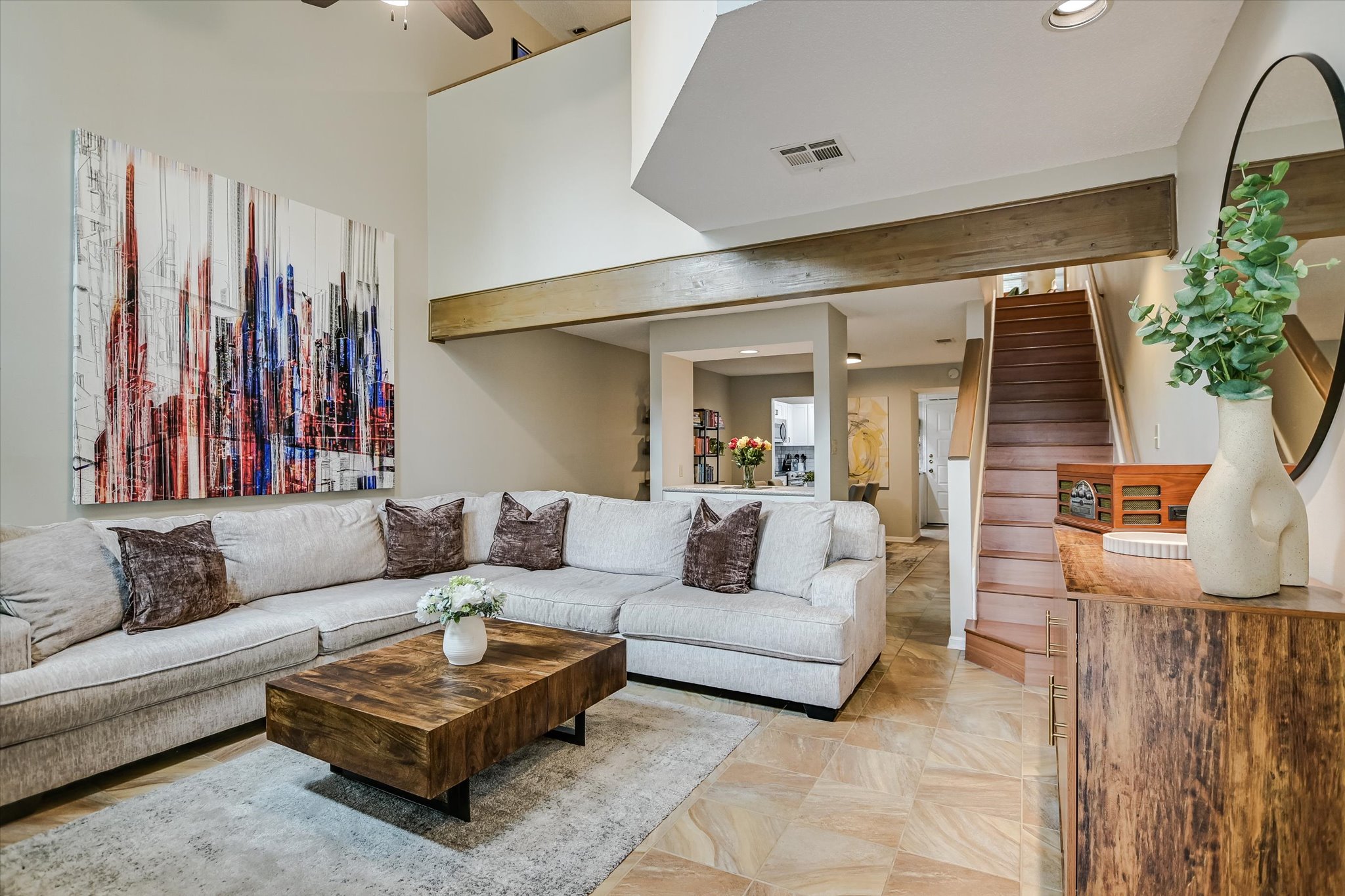 a living room with furniture and a large window