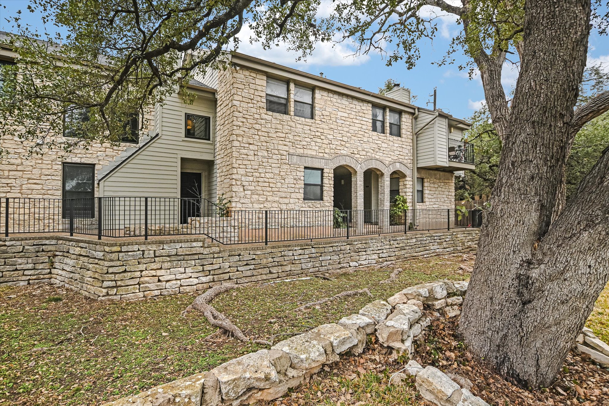 9226 Jollyville Road, Unit 122 Austin, TX 78759 - Photo 19 of 20 a view of a house with a yard
