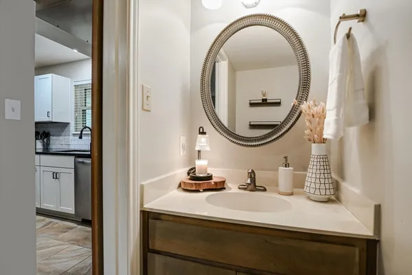 a bathroom with a sink and a mirror