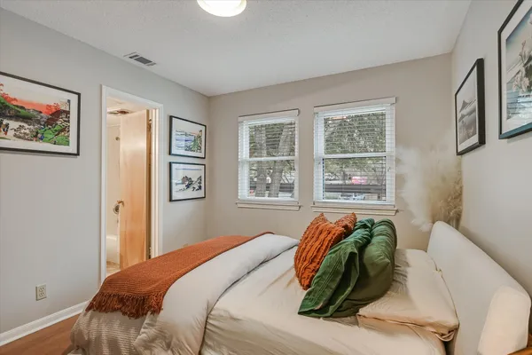 a bedroom with bed and a window