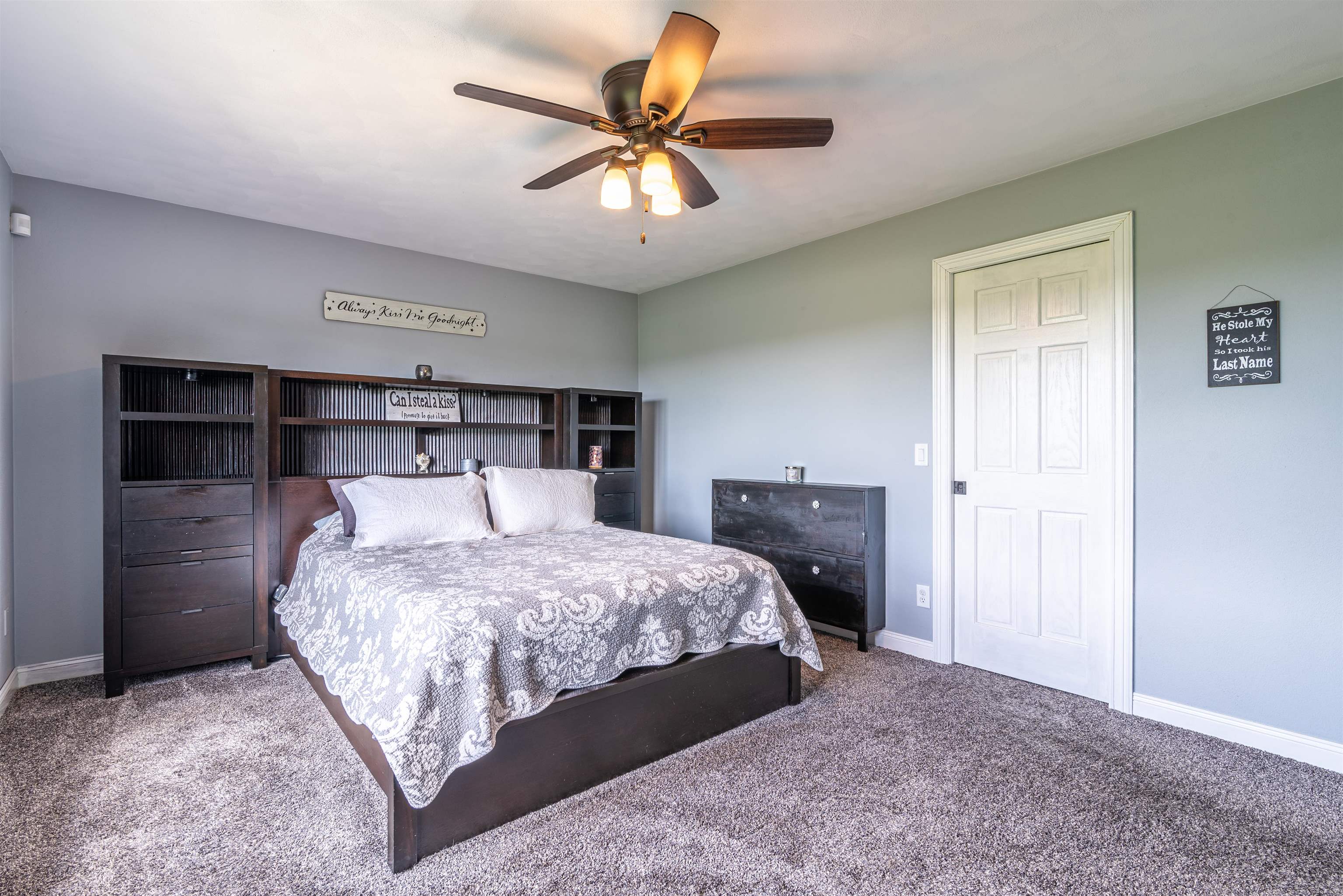 14245 Clover Road Rockton, IL 61072 - Photo 26 of 51 a bedroom with a bed and a chandelier