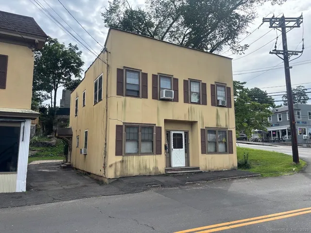 a view of a white house with a large windows