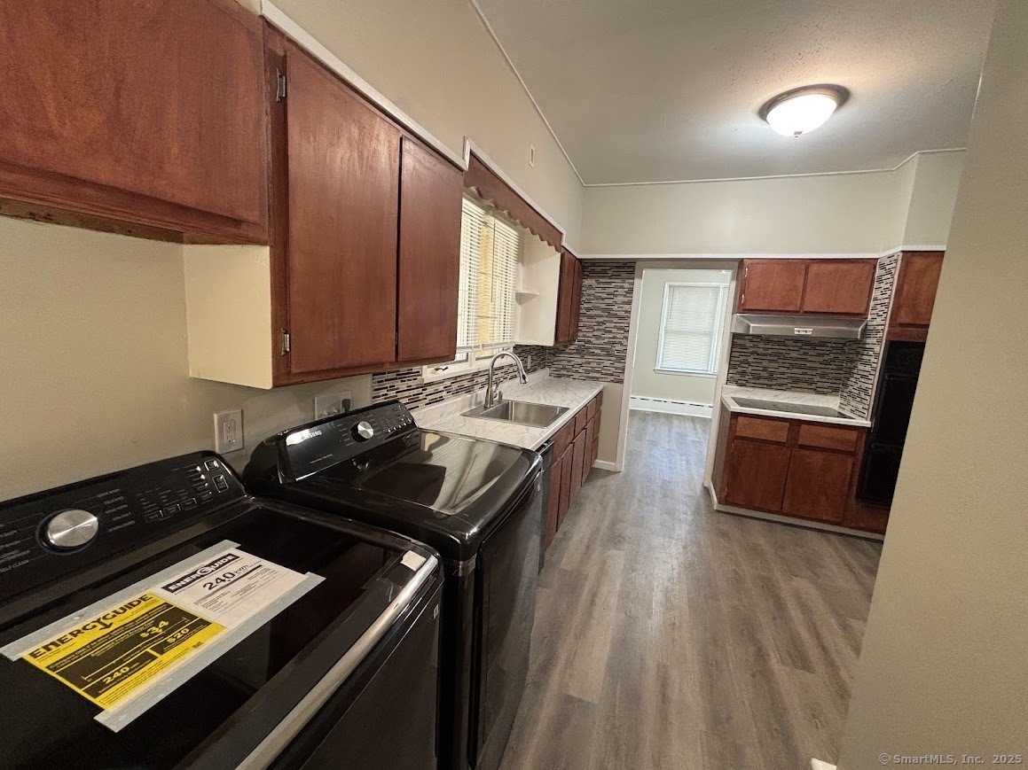 156 River Rd Extension, Unit 2 Greenwich, CT 06807 - Photo 2 of 15 a kitchen with a stove and a refrigerator