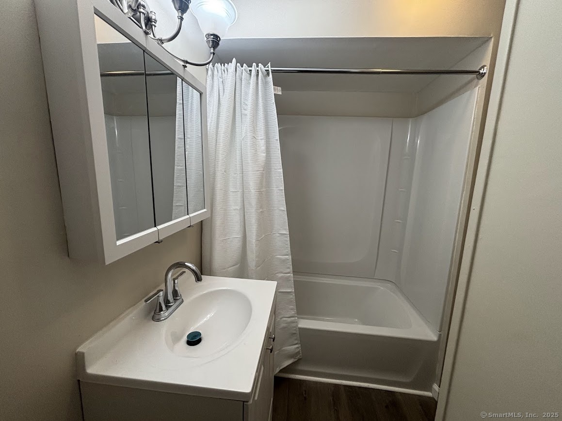 156 River Rd Extension, Unit 2 Greenwich, CT 06807 - Photo 5 of 15 a bathroom with a sink and a tub