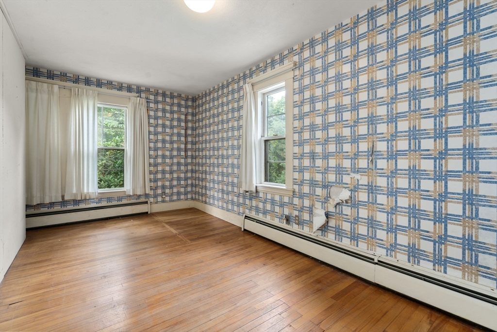 145 Tower Road Lincoln, MA 01773 - Photo 13 of 26 a view of wooden floor and windows in a room