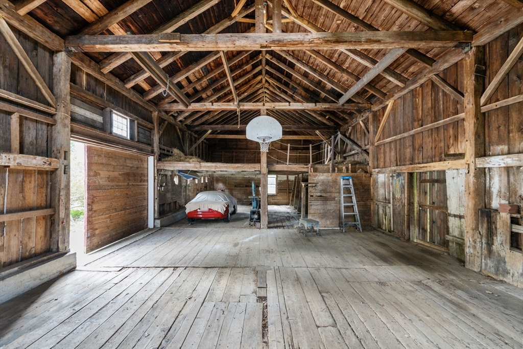 145 Tower Road Lincoln, MA 01773 - Photo 26 of 26 a view of a garage with wooden floor