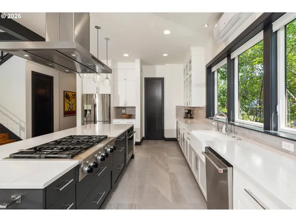 a kitchen with a sink and a large window