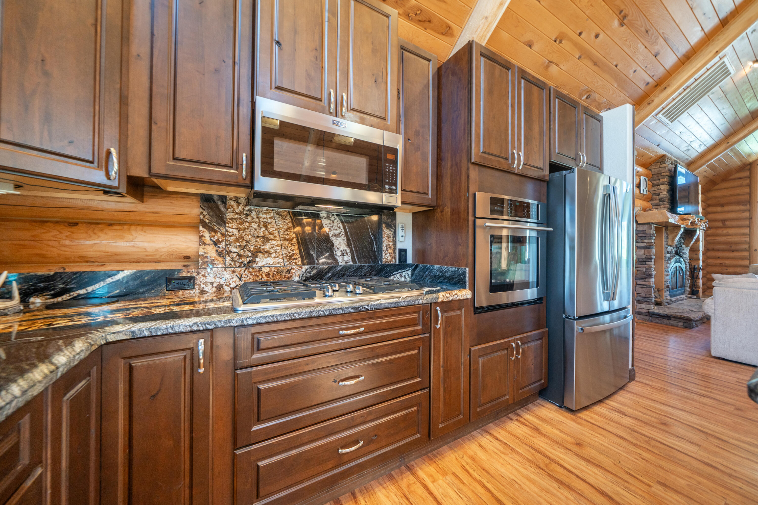 11875 Oak Run Road Oak Run, CA 96069 - Photo 15 of 127 a kitchen with stainless steel appliances granite countertop a refrigerator and a stove top oven