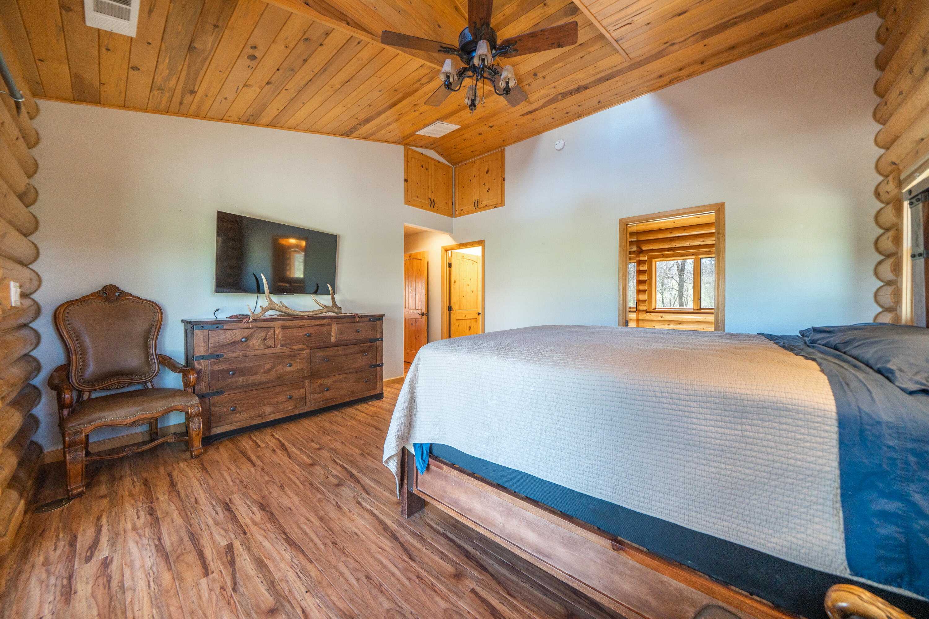 11875 Oak Run Road Oak Run, CA 96069 - Photo 20 of 127 a bedroom with a bed and wooden floor