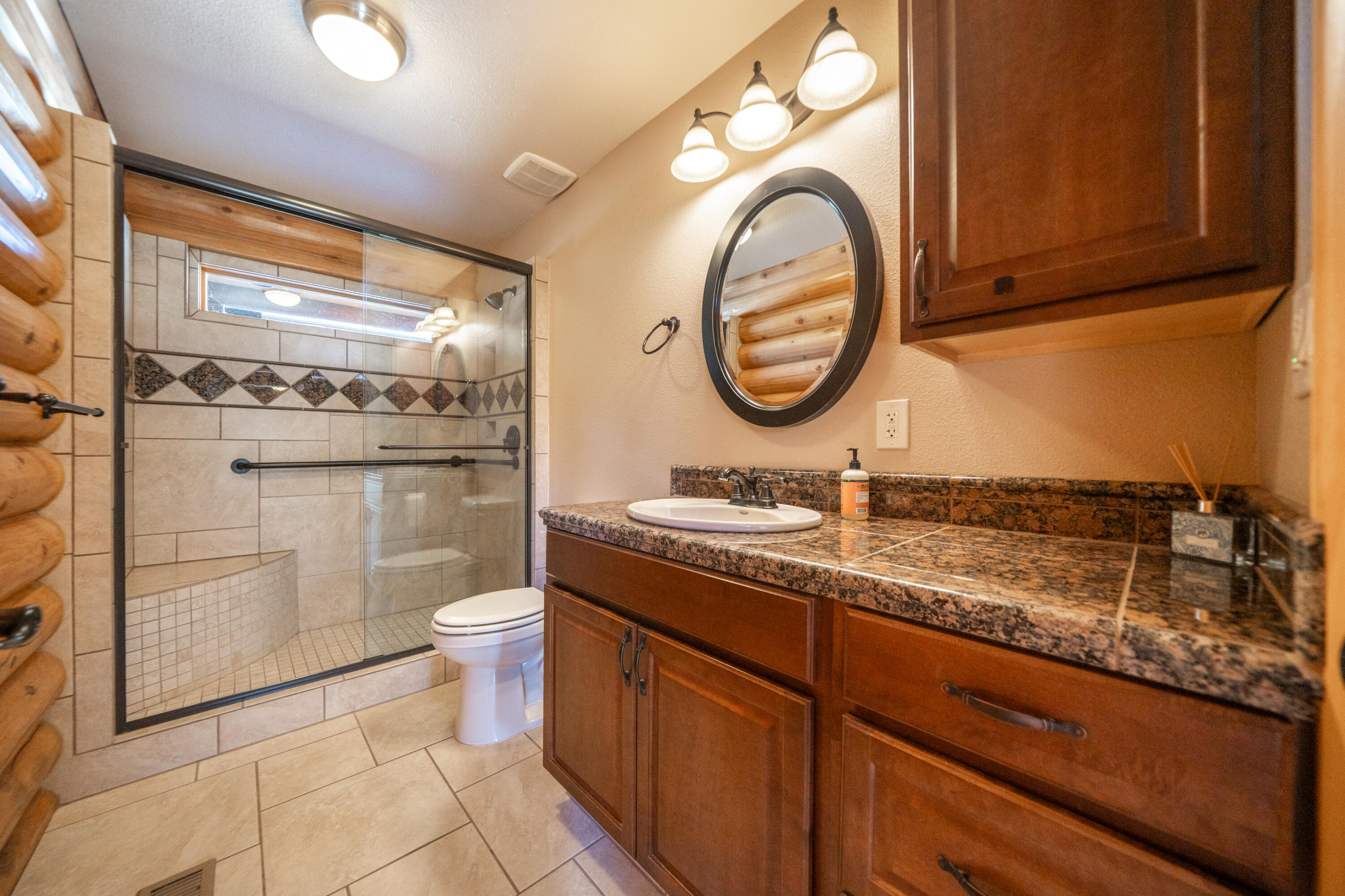 11875 Oak Run Road Oak Run, CA 96069 - Photo 28 of 127 a bathroom with a granite countertop toilet sink and mirror